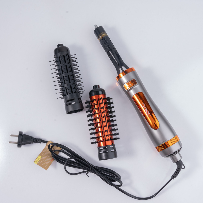 سشوار برس‌دار چرخشی 1200 وات کرونیر مدل CR-6855، موتور AC، وزن 350 گرم، المنت فلز، دارای سری برس‌دار گرد باریک، سری برس‌دار گرد پهن با ویژگی صاف‌کنندگی، حجم‌دهندگی، با قابلیت باد سرد، سیم گردان