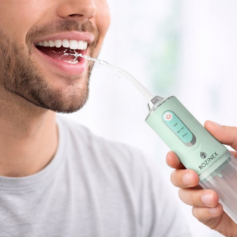 دستگاه شست‌وشوی دهان و دندان شارژی روزینکس مدل WHITE TEETH