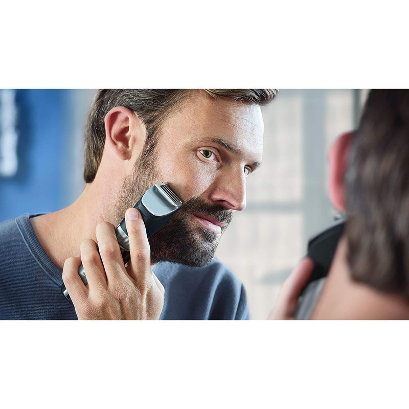 ماشین اصلاح موی صورت فیلیپس مدل BT981013 با تیغه استیل ضدزنگ، فناوری PowerAdapt Sensor، استفاده خشک و مرطوب، ضد آب، شانه فلزی قابل تنظیم، باتری لیتیوم یونی با شارژ سریع 60 دقیقه و زمان استفاده 120 دقیقه، طراحی ارگونومیک و منبع انرژی برق و باتری