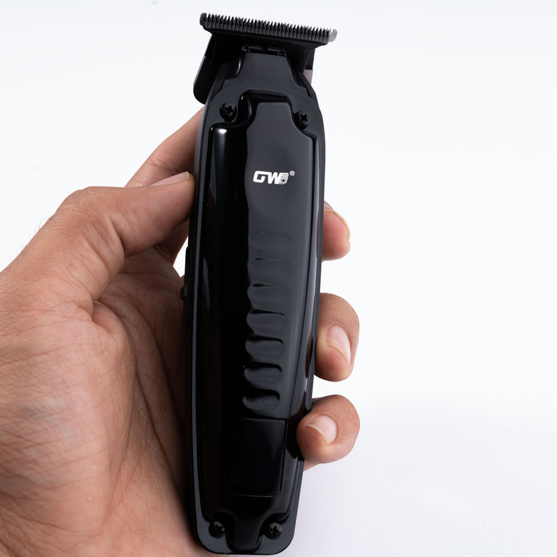ماشین اصلاح موی سر و صورت جی دبلیو مدل GW-9979، اصلاح به صورت صفر زن، خط زن، منبع انرژی باتری، تکنولوژی اصلاح به صورت تریمر، مدت زمان شارژ 120 دقیقه و مدت زمان استفاده پس از شارژ 120 دقیقه، به همراه کابل شارژ، برس تمیزکننده، روغن، 4 عدد شانه، عملکرد توربو