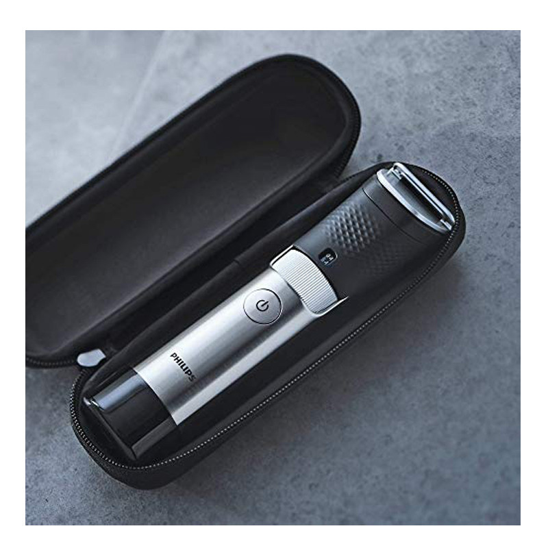 ماشین اصلاح موی صورت فیلیپس مدل BT981013 با تیغه استیل ضدزنگ، فناوری PowerAdapt Sensor، استفاده خشک و مرطوب، ضد آب، شانه فلزی قابل تنظیم، باتری لیتیوم یونی با شارژ سریع 60 دقیقه و زمان استفاده 120 دقیقه، طراحی ارگونومیک و منبع انرژی برق و باتری