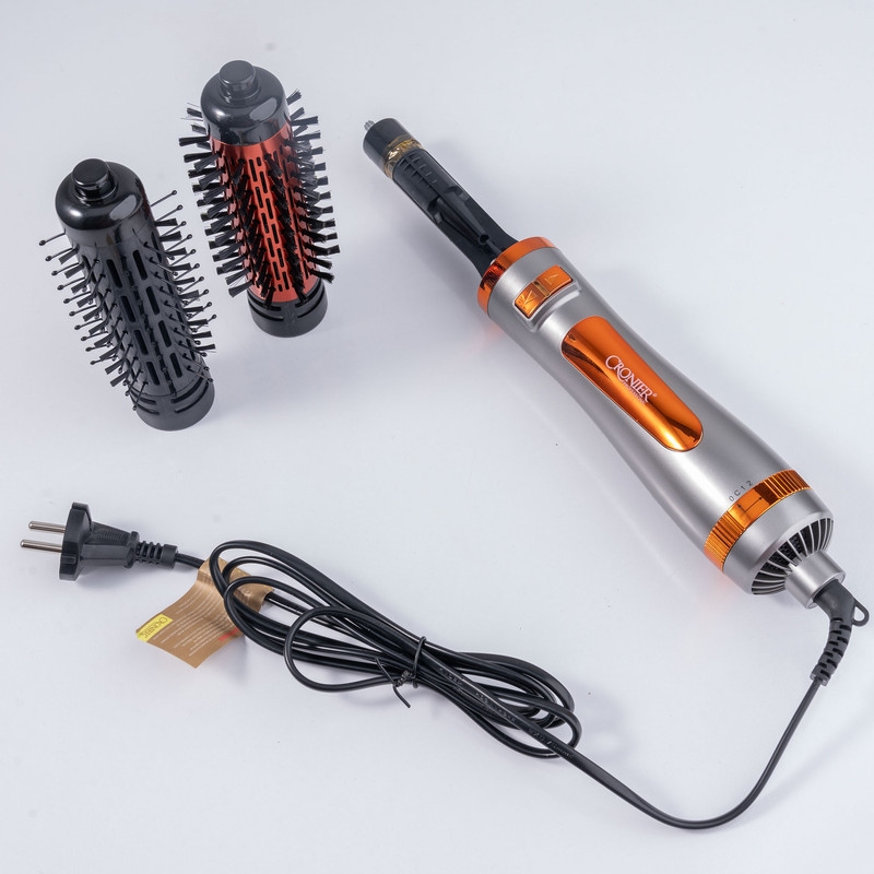 سشوار برس‌دار چرخشی 1200 وات کرونیر مدل CR-6855، موتور AC، وزن 350 گرم، المنت فلز، دارای سری برس‌دار گرد باریک، سری برس‌دار گرد پهن با ویژگی صاف‌کنندگی، حجم‌دهندگی، با قابلیت باد سرد، سیم گردان